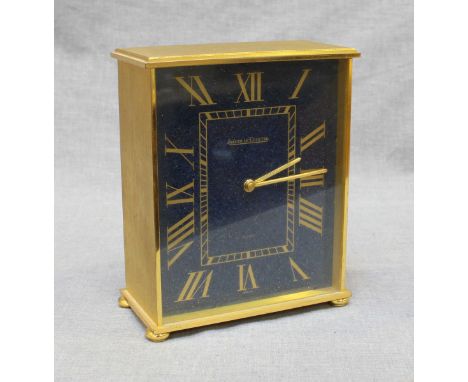 A Jaeger LeCoultre gilt brass mantle clock, the simulated Lapis Lazuli effect dial with Roman numerals denoting hours, Quartz