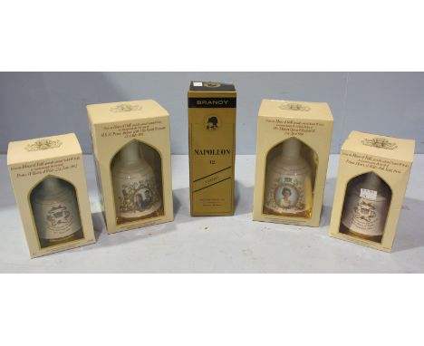 Four royal commemorative Bells whiskey decanters, the ceramic decanters made by 'Wade,' together with a 1 litre bottle of Ant