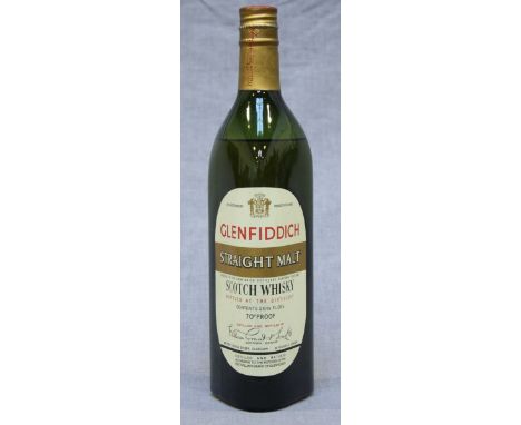 A Glenfiddich 1963 straight malt scotch Whisky, 26 2/3 fl oz and 70° proof, in clan tin