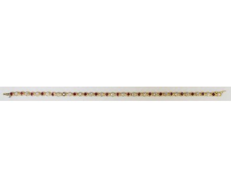 A David Morris 18ct yellow gold, diamond and ruby line bracelet, the circular links set with alternating stones comprising 20