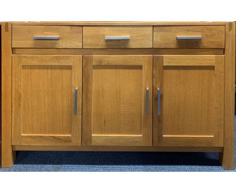 A contemporary heavy quality light oak sideboard, 140 x 108cm.