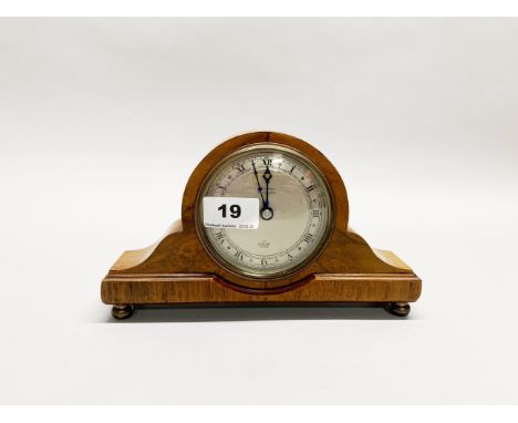 A pretty Elliott walnut mantle clock c. 1950's understood to be in full working order with eight day movement, H. 13.5cm.