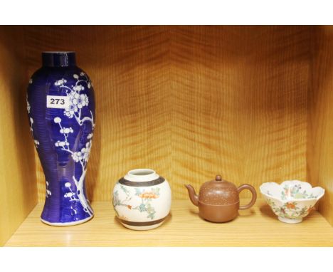 A Chinese prunus design porcelain vase, H. 32cm, together with three further Chinese ceramic items.