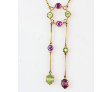 An antique 9ct yellow gold necklace set with round cut amethysts, peridots and seed pearls, L. 40cm. Probably a suffragette i