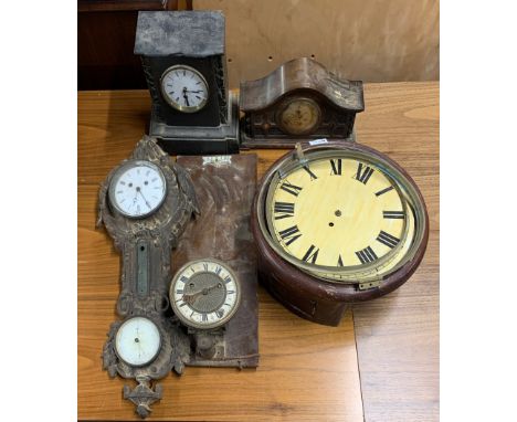 A group of clocks and clock parts including a cast iron wall clock/barometer.