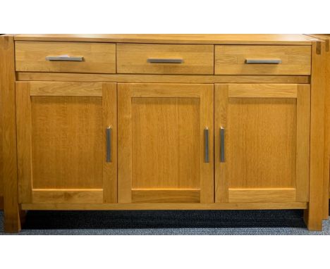 A contemporary heavy quality light oak sideboard, 140 x 108cm.
