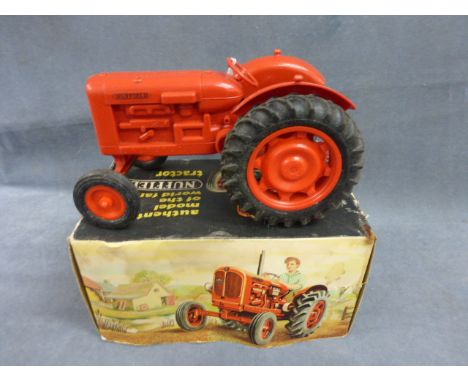 Boxed Pippin Toys Nuffield Tractor in red, gd condition, no exhaust