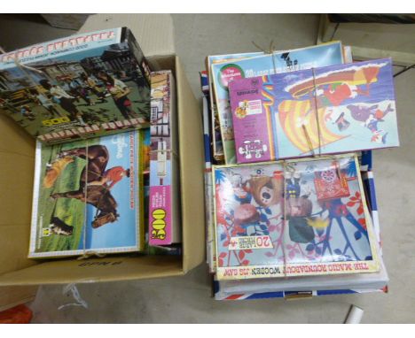 Two boxes jigsaw puzzles including Disney, Noddy, The Magic Roundabout etc