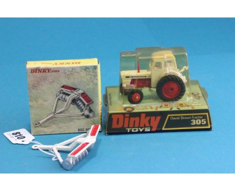 Dinky bubble pack 305 David Brown Tractor in white with red hubs vg, usual discolouring to packaging, carded part vg  plus bo