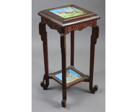 A late Victorian carved beech two-tier lamp table inset two humorous painted tiles, depicting foxes running to their den, &am