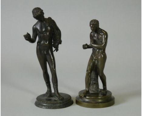 Two 19th century Grand Tour bronze figures of Narcissus &amp; Damoxenos, each on circular base; 5¼” &amp; 4½” high.