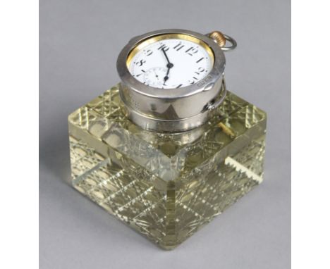 An Edwardian large heavy glass &amp; silver-mounted square inkwell of pale amber colour, with canted corners &amp; hobnail ba