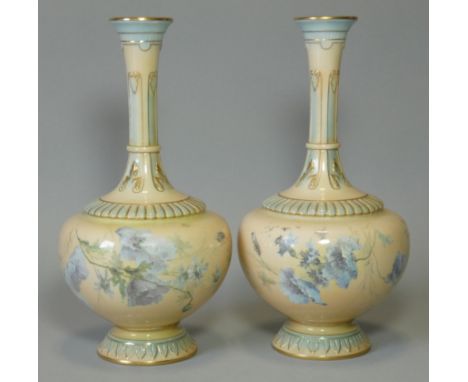 A pair of Royal Worcester porcelain vases with squat round bodies &amp; tall narrow necks, apricot ground with turquoise &amp