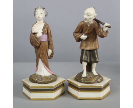 A pair of Royal Worcester porcelain standing male &amp; female Japanese figures decorated in bronzed enamels with coloured hi