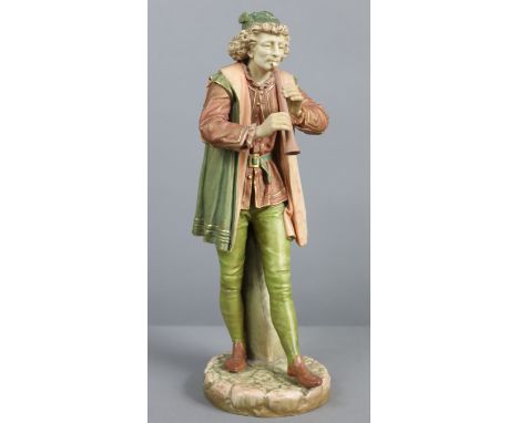A Hadley’s Worcester porcelain standing male “Italian Musician” figure playing a pipe, wearing peach tunic &amp; green coat &