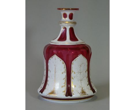 A 19th century Bohemian overlaid glass hookah base, of ruby ground with white opaque overlay &amp;gilt decoration (worn); 6¾”