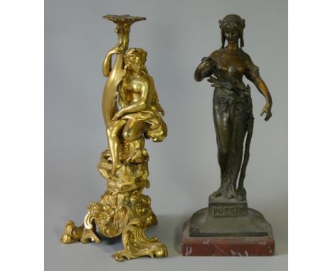 A 19th century French ormolu figural candlestick with a classical figure seated on the dolphin support, on foliate scroll bas