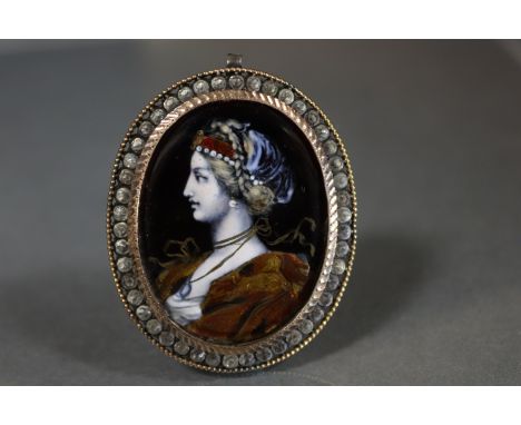 A 19th century Limoges enamel oval pendant painted with the bust of a noblewoman in the renaissance style, within a paste-set