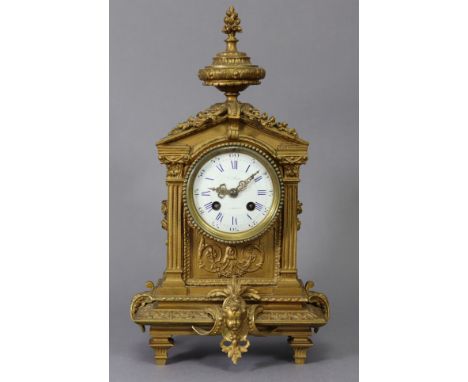 A 19th century French mantel clock, the 3¼” diam. white enamel convex dial with blue roman numerals &amp; Arabic five-minute 