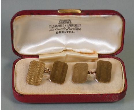 A pair of 9ct gold rectangular cufflinks with engine-turned decoration, 5.6g total.
