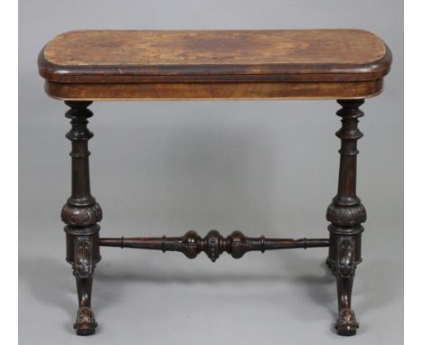 A Victorian burr-walnut veneered card table, the rectangular fold-over top with rounded corners, moulded edge &amp; inset gre