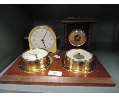 A selection of barometers clock and timer