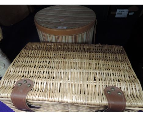 A selection of storage containers including wicker hamper