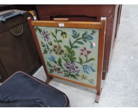 A tapestry fire screen