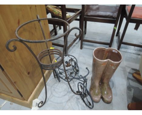 A selection of garden decorations including ceramic wellingtons