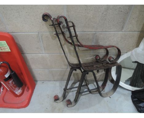 A pair of metal bench ends