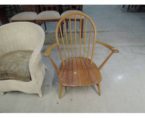 An Ercol spindle back low armchair
