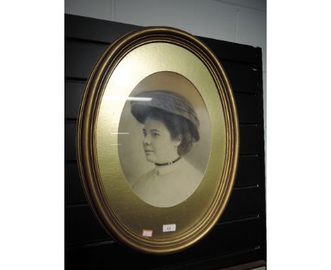 An Edwardian portrait in gilt oval frame