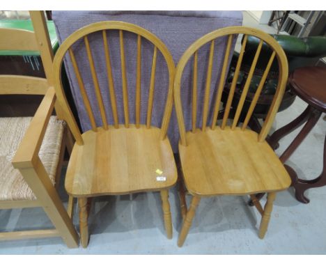 A pair of traditional hoop and stick back kitchen chairs