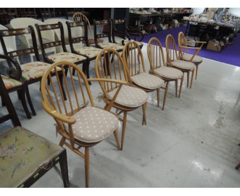 A set of 6 (4 plus 2) Ercol hoop and stick back dining chairs