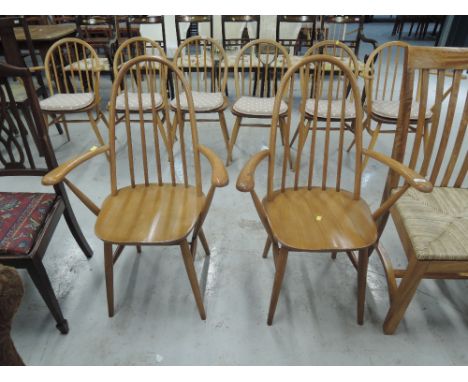 A pair of Ercol style hoop and stick back carver chairs