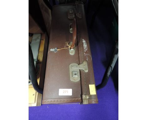 A small size leather bound travel trunk or suitcase