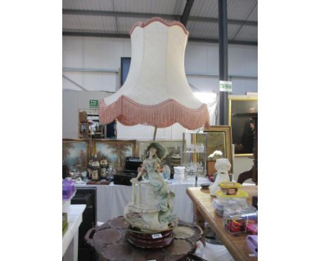 A large figural Florence Capo Di Monte lamp with shade