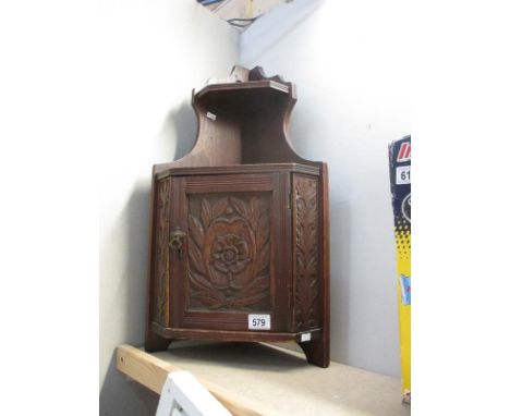 A vintage hanging shelf cupboard