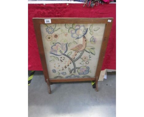 A fire screen with embroidered panel featuring Bird of Paradise