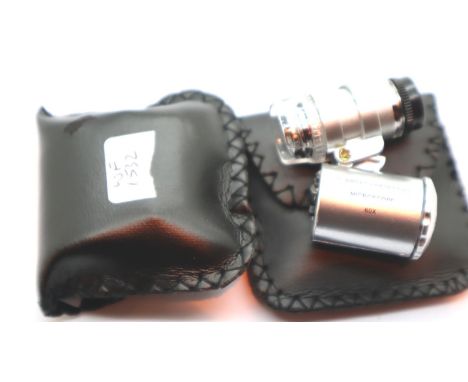 Two Currency/jewellers loupe (60x) with LED light. P&amp;P Group 1 (£14+VAT for the first lot and £1+VAT for subsequent lots)
