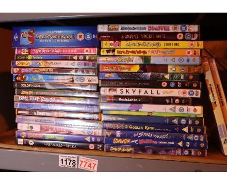 Shelf of mixed DVDs including Scooby Doo. Not available for in-house P&amp;P, contact Paul O'Hea at Mailboxes on 01925 659133