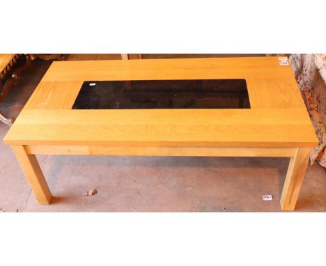 Heavy light oak coffee table, with speckled black glass inner, 115 cm x 60 cm x 40 cm (approx 45?x 24?x 16?). Not available f