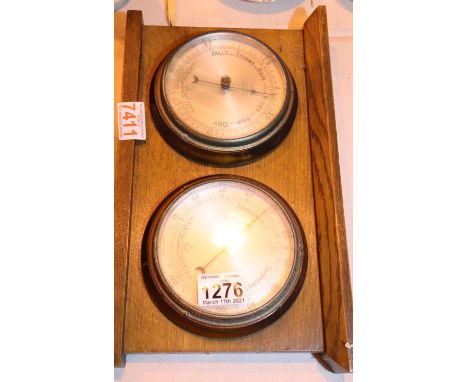 Oak mounted painted style barometer and thermometer. Not available for in-house P&amp;P, contact Paul O'Hea at Mailboxes on 0