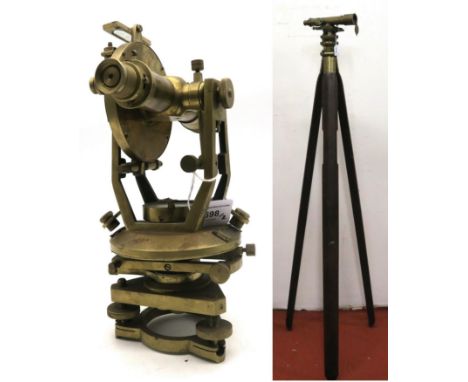 A military issue brass theodolite stamped "W. No. 29703" and "B. 3251." under Broad Arrow, mounted upon a substantial wooden 