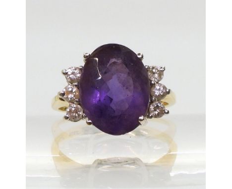 A 14k gold Amethyst and Diamond ring, set with an estimated approx 0.18cts brilliant cut diamonds, size J, weight 3.7gms Cond