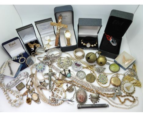 A silver curb chain necklace, a Cameronians (Scottish Rifles) cap badge, a pair of folding scissors in a silver case, vintage