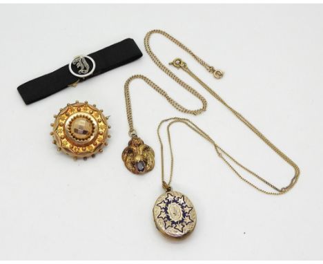 A yellow metal garnet set pendant and chain, a yellow metal back &amp; front locket engraved with an anchor on one side and e
