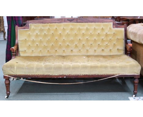 A Victorian rosewood framed button back upholstered parlour settee on turned front supports terminating in ceramic casters, 8