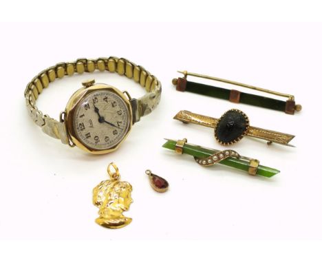 Two new Zealand jade brooches, one stamped 9ct, a further jewel beetle brooch in a yellow metal mount, a 9ct cased ladies wat