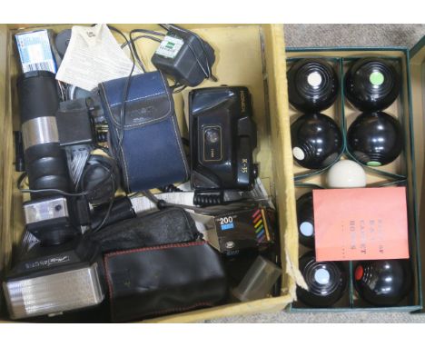 A boxed set of B&amp;A Indoor Carpet Bowls, together with a small selection of vintage camera equipment Condition Report:Avai